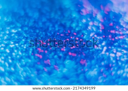 Blur light flare. Bokeh glow overlay. LED radiance reflection. Defocused neon blue pink color shiny round glitter glare decorative abstract background.
