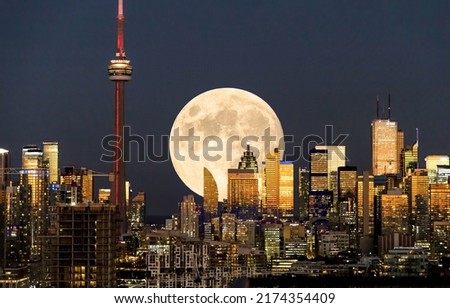 Full moon over Toronto at night. Toronto night full moon. Moonshine in night Toronto. Night cityscape full moon Royalty-Free Stock Photo #2174354409