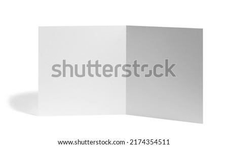 close up of a  blank folded leaflet white paper on white background 