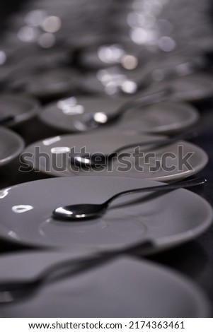 Long row of spoon dishes placed along a bar or table. High quality photo
