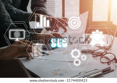 SEO Concept, Search Engine Optimization, Businessteam using laptop computer with VR screen seo icon, concept for promoting ranking traffic on website.