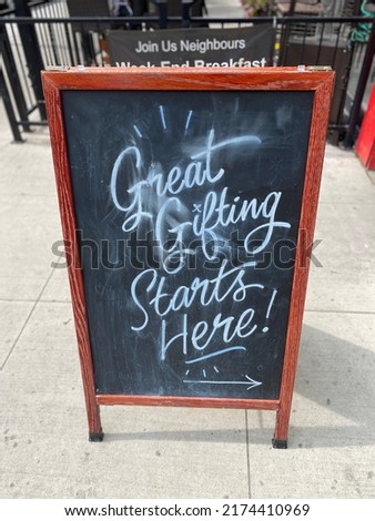 Great gifting starts here sidewalk storefront advertising signage on Sussex Street Ottawa Ontario Canada.