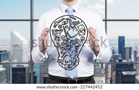 Businessman presenting a 'start up' strategy. Office background.