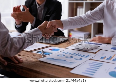 Business handshake for teamwork of business merger and acquisition,successful negotiate,hand shake,two businessman shake hand with partner to celebration partnership and business deal concept Royalty-Free Stock Photo #2174454519