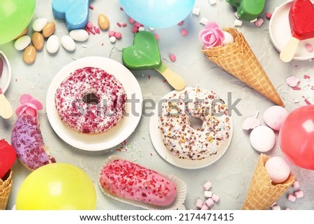 Differen type of ice-cream on gray background. Atmospheric summer concept. Top view, flat lay