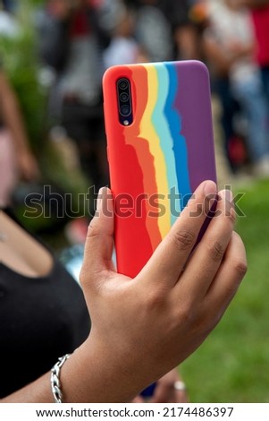 Young woman making a selfie at the gay pride festival,rainbow colors.Believe,dreams