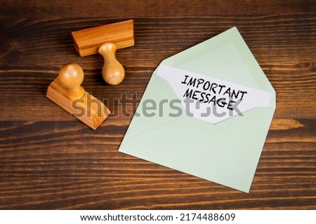 Important Message. Information in letter on wooden texture table.