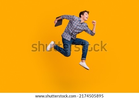 Full size photo of funky man jump use laptop search social media online wear casual style clothing isolated over bright background