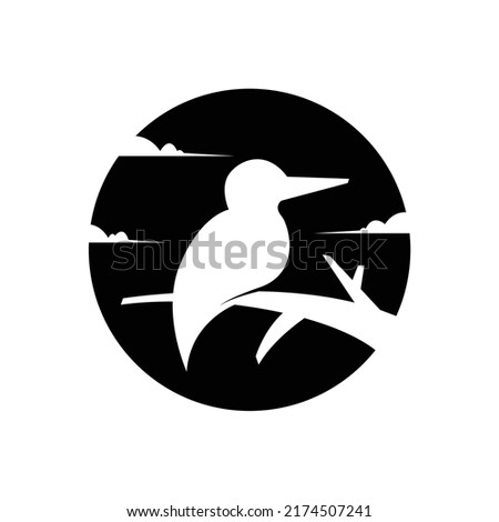 silhouette of a little bird on a tree logo vector