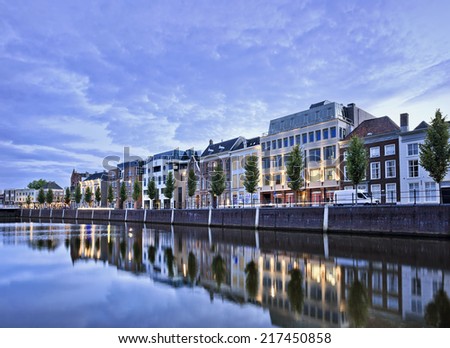 Stately mansions mirrored in a harbor at twilight, Breda, The Netherlands Royalty-Free Stock Photo #217450858