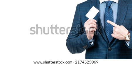 cropped man in suit pointing finger on empty debit or business card for copy space, advertisement. Horizontal poster design. Web banner header, copy space.