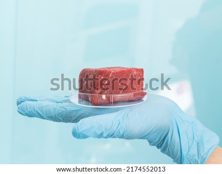 Lab grown meat concept - meat in petri dish Royalty-Free Stock Photo #2174552013
