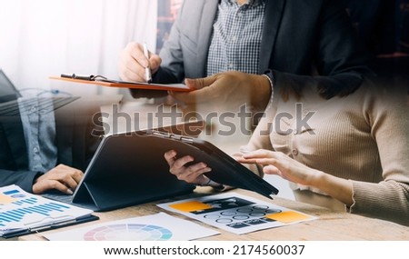 Businessman hand working digital marketing media in virtual screen with mobile phone and modern compute with VR icon diagram at office in morning light