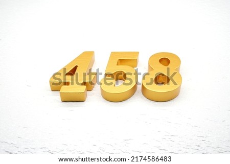  Number 458 is made of gold-plated teak, 1 cm thick, laid on a white painted aerated brick floor, giving good 3D visibility.                                     