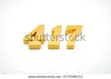    Number 417 is made of gold-plated teak, 1 cm thick, laid on a white painted aerated brick floor, giving good 3D visibility.                                      