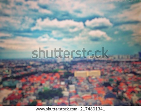 Defocused abstract background of  a beautiful combination of the clouds under the blue sky with the residents' houses