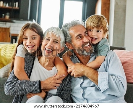 Portrait of grandparents and grandchildren having fun together at home Royalty-Free Stock Photo #2174604967