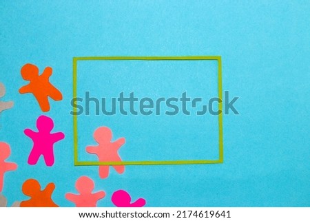 colorful paper people, cheerful people on blue background with green frame as copy and product space, modern design, abstract minimal concept