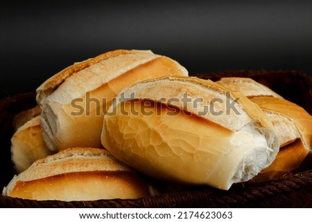 Closeup of portion of french bread typical of Brazil on black background Royalty-Free Stock Photo #2174623063