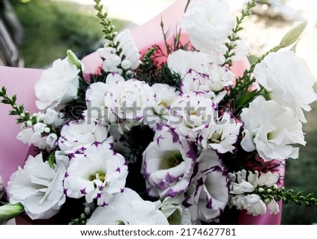 Festive white bouquet of flowers on a green background, a bouquet of pink color, background, flowers are white beautiful