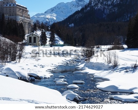 beautiful winter wonderland in Switzerland with snowy landscape and river