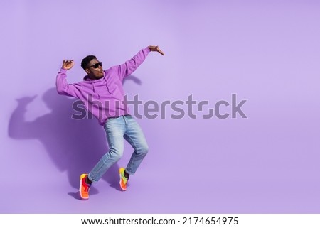 Full length profile photo of overjoyed carefree person stand tip toe dancing isolated on purple color background Royalty-Free Stock Photo #2174654975