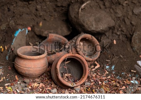 Small broken Clay pots along the roadside Royalty-Free Stock Photo #2174676311