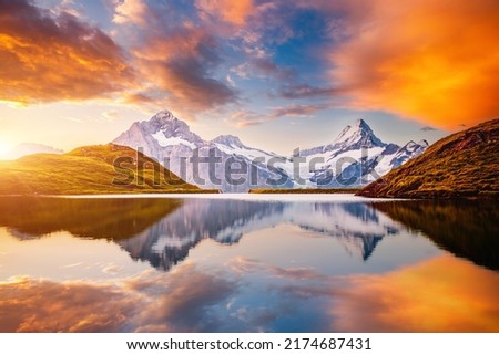 Majestic view of the high cliffs above lake Bachalpsee. Location Swiss alps, Switzerland, Grindelwald valley, Bernese Oberland, Europe. Photo wallpaper. World landmarks. Discover the beauty of earth. Royalty-Free Stock Photo #2174687431