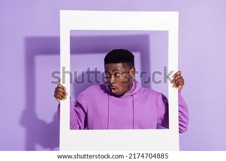 Photo of impressed handsome man open mouth stare interested empty space isolated on purple color background