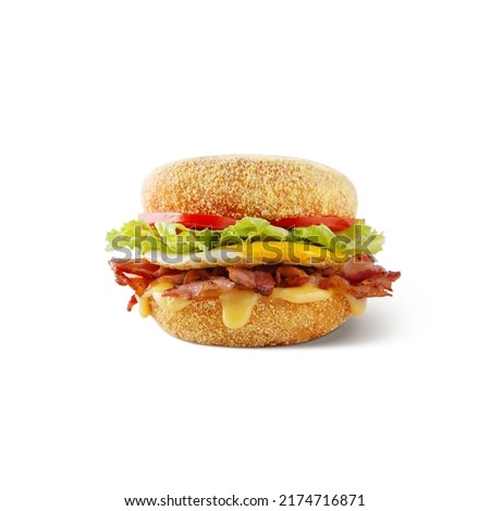 Hamburger with sauce, bacon, egg, lettuce, tomatoes and sauce on a white background