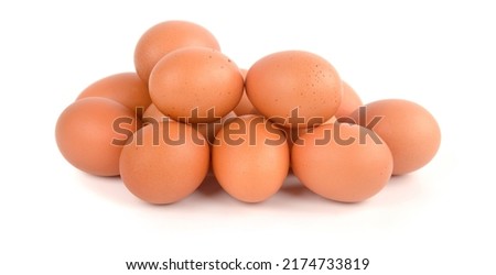 Chicken egg pile on a white background. Royalty-Free Stock Photo #2174733819