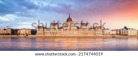 Panorama of the Hungarian Parliament building at sunrise in Budapest, Hungary Royalty-Free Stock Photo #2174744019