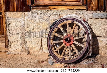 An old wagon wheel view. Vintage wagon wheel. Cart wheel. Old wagon wheel Royalty-Free Stock Photo #2174745229