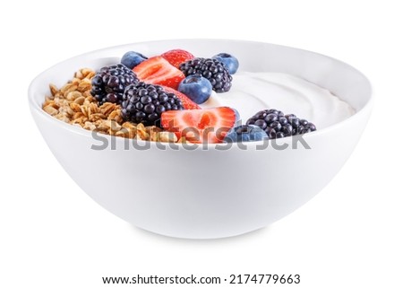 Fresh breakfast with greek yogurt nuts oatmeal granola with berries in a bowl on a white isolated background. the toning. selective focus Royalty-Free Stock Photo #2174779663