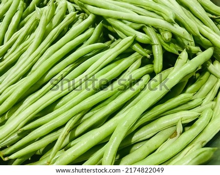 Fresh organic green beans(Bush bean,Snab bean,Green bean,Common bean)group in the container for sell in the supermarket. Ingredient for cooking food,delicious with very good benefits and high vitamins Royalty-Free Stock Photo #2174822049