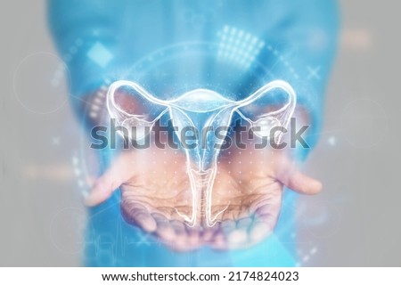 Medical concept, doctor's hands in a blue coat close-up. Ultrasound of the uterus, x-ray, hologram. Medical care, woman anatomy, doctor's appointment, reproductive system. mixed media Royalty-Free Stock Photo #2174824023
