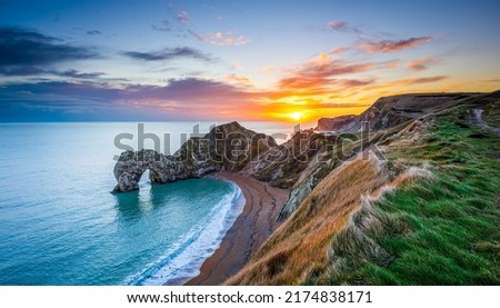 Dawn over the sea coast. Beautiful sunrise over coastline. Sea coast at dawn. Panoramic landscape of sea coast at dawn Royalty-Free Stock Photo #2174838171
