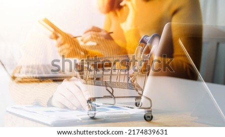 Businessman hand working digital marketing media in virtual screen with mobile phone and modern compute with VR icon diagram at office in morning light