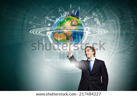 Businessman in suit touching icon of media screen. Elements of this image are furnished by NASA