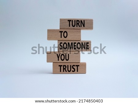 Turn to Someone you trust symbol. Wooden blocks with words Turn to Someone you trust. Beautiful white background. Business and Turn to Someone you trust. Copy space.