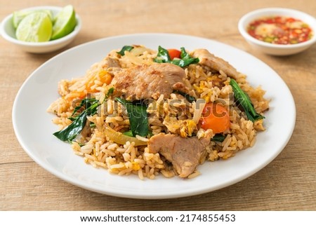 Homemade fried rice with pork on white plate Royalty-Free Stock Photo #2174855453