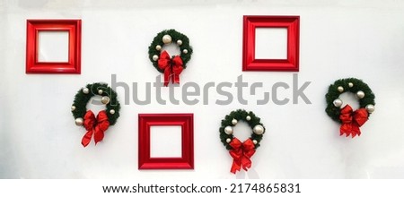 Christmas, happy new year wreath decoration with red ribbon, white ball and red picture frame for add wording isolated on white wall background. Object for decorated party, festival with copy space. 