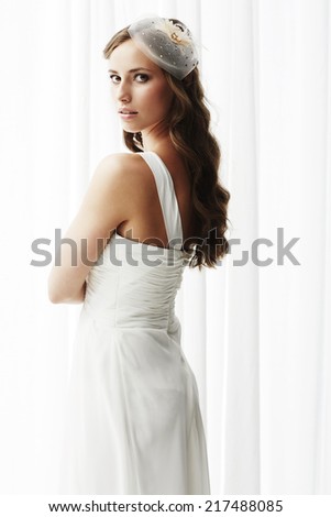 Young bride in wedding dress, studio shot  