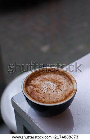 Bandung, Indonesia - June 6 2022: Trypophobia, cappuccino is a coffee drink that today is typically composed of a single espresso shot and hot milk, with the surface topped with foame
