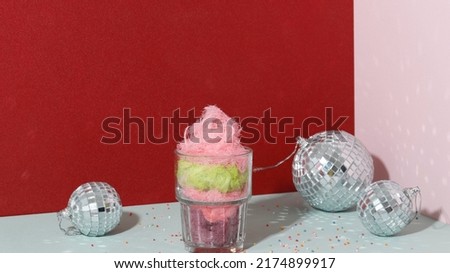 Three Color Cotton Candy or Rambut Nenek on a Glass, Party Concept. Copy Space for Text