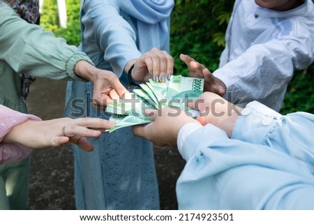 tradition for sharing happiness in the form of money on Eid holidays