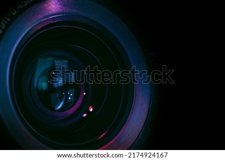 Close up Beautiful camera lens with multi colored light. Background pattern for design.	 Royalty-Free Stock Photo #2174924167