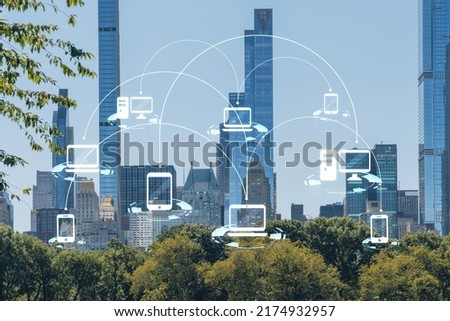 Green lawn at Central Park and Midtown Manhattan skyline skyscrapers at day time, New York City, USA. Social media hologram. Concept of networking and establishing new people connections