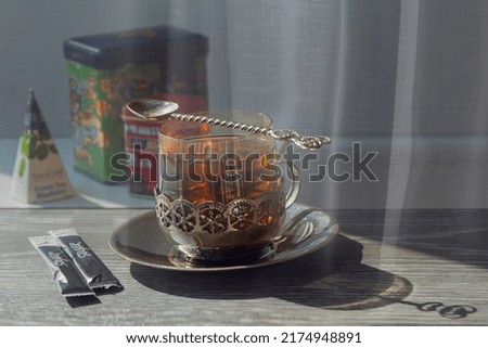 Still life with a glass of tea.Antique tea set.