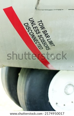 Tow bar limit unless scissors disconnected decal on an old aircraft